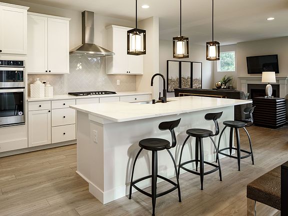 Enjoy your coffee each morning at the stylish kitchen island bar.