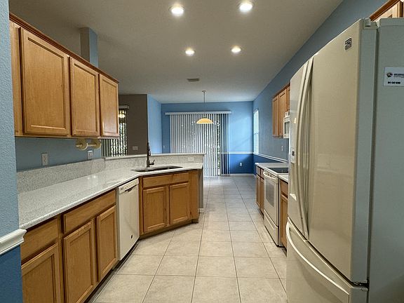 Spacious kitchen with solid wood cabinets