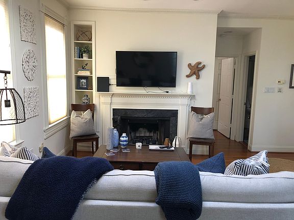 Wood-burning fireplace and built-ins with western exposure make this a cozy and sunny spot to relax!