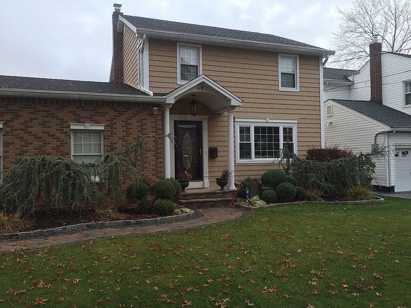 Front of Home
						:
						New roof, siding, front door and paver driveway and walkway. Lush landscaping