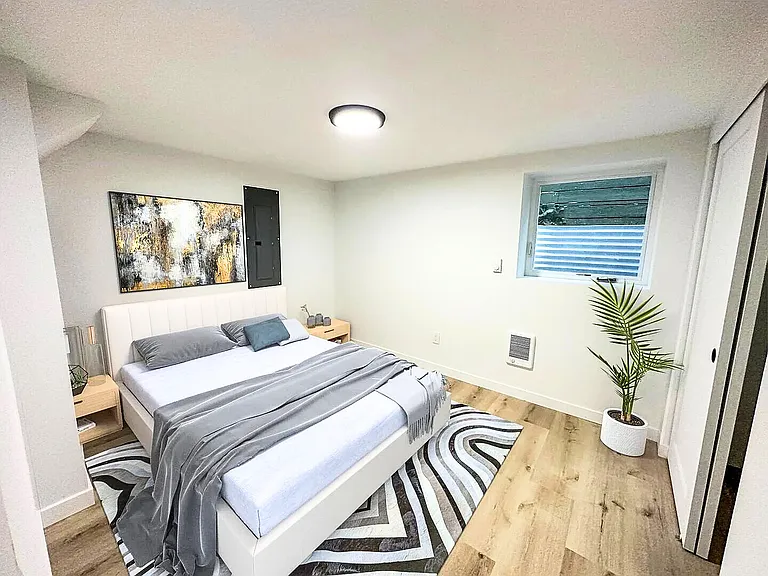 Bedroom layout option showing queen bed setup and clean finishes.