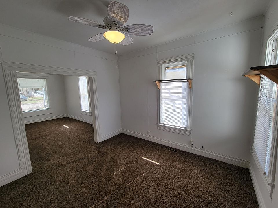 Dining room, and living room on left, from doorway of kitchen