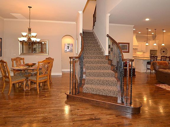 Staircase separates formal dining room from family room