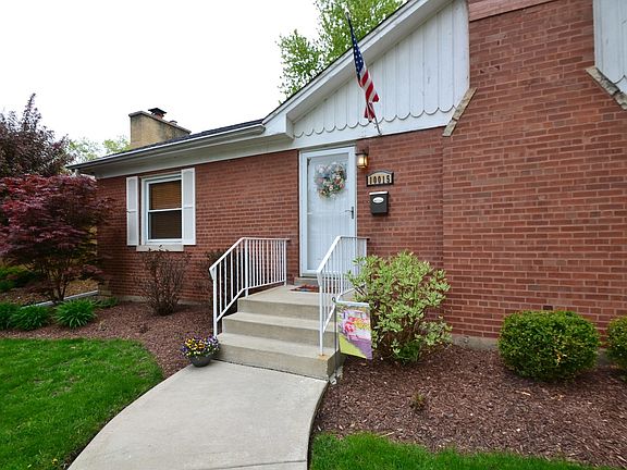 Pretty Landscaping and welcoming curved walkway to front door!