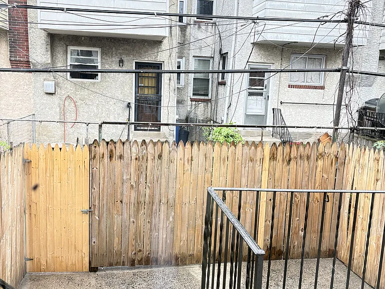 Fenced back yard with patio