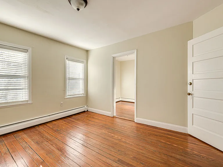 living room- door leads into flex space- great for an office or exercise space