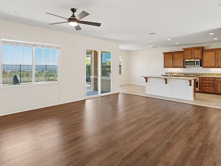 Formal Family Room with Fan and access to the backyard and view.