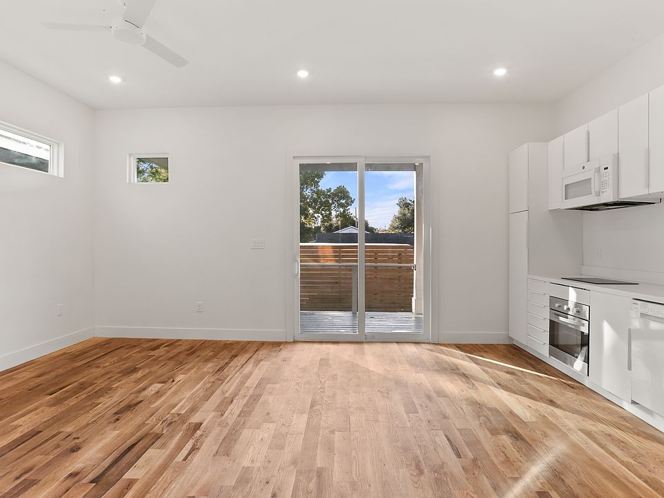Main living room features a large slider onto the semi-private back porch.