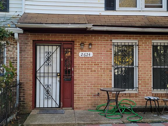 Fenced and paved front yard