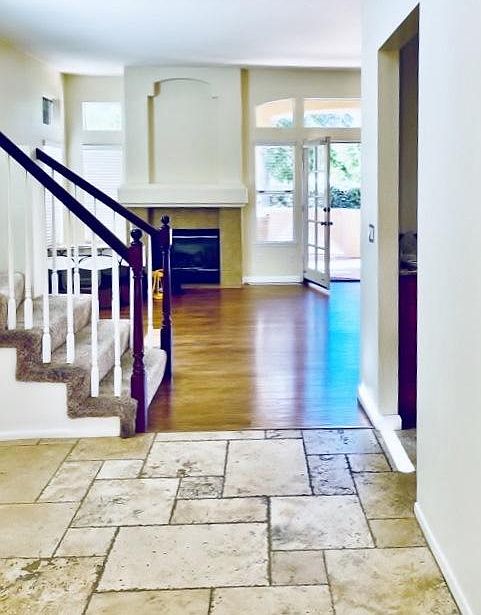 Entry to open planned great room. Note gas fireplace
