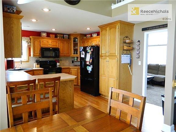 Large kitchen with so much cabinet and counter space! Opens to the dining room and family room. Walkout to the pergola and big deck!