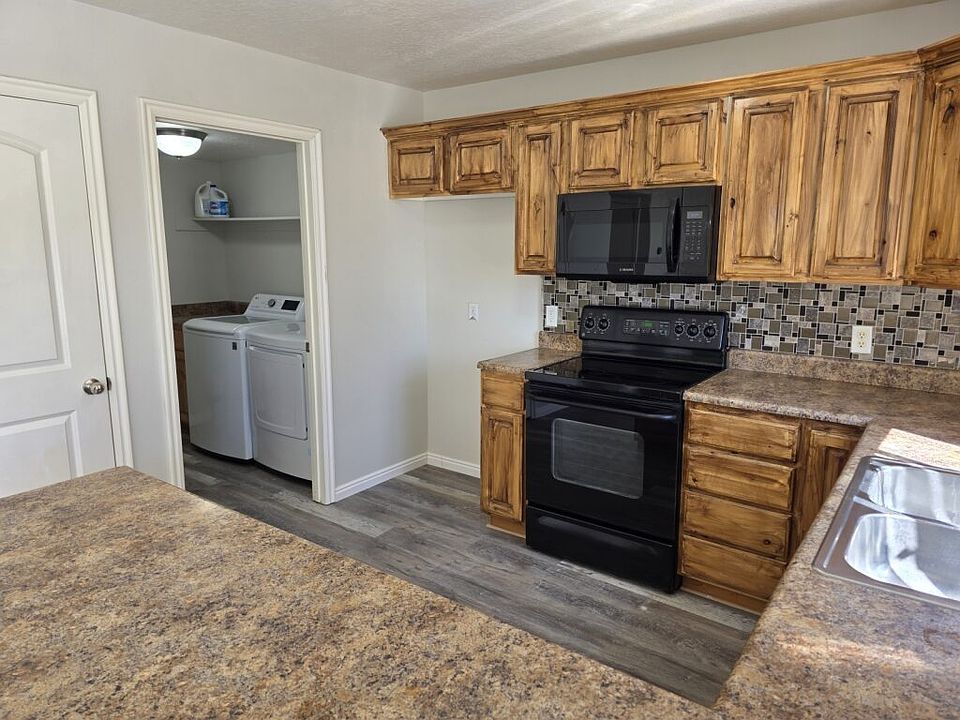 Stainless steel refrigerator coming soon. Electric Stove and pantry lots of cabinet space and laundry room with shelves