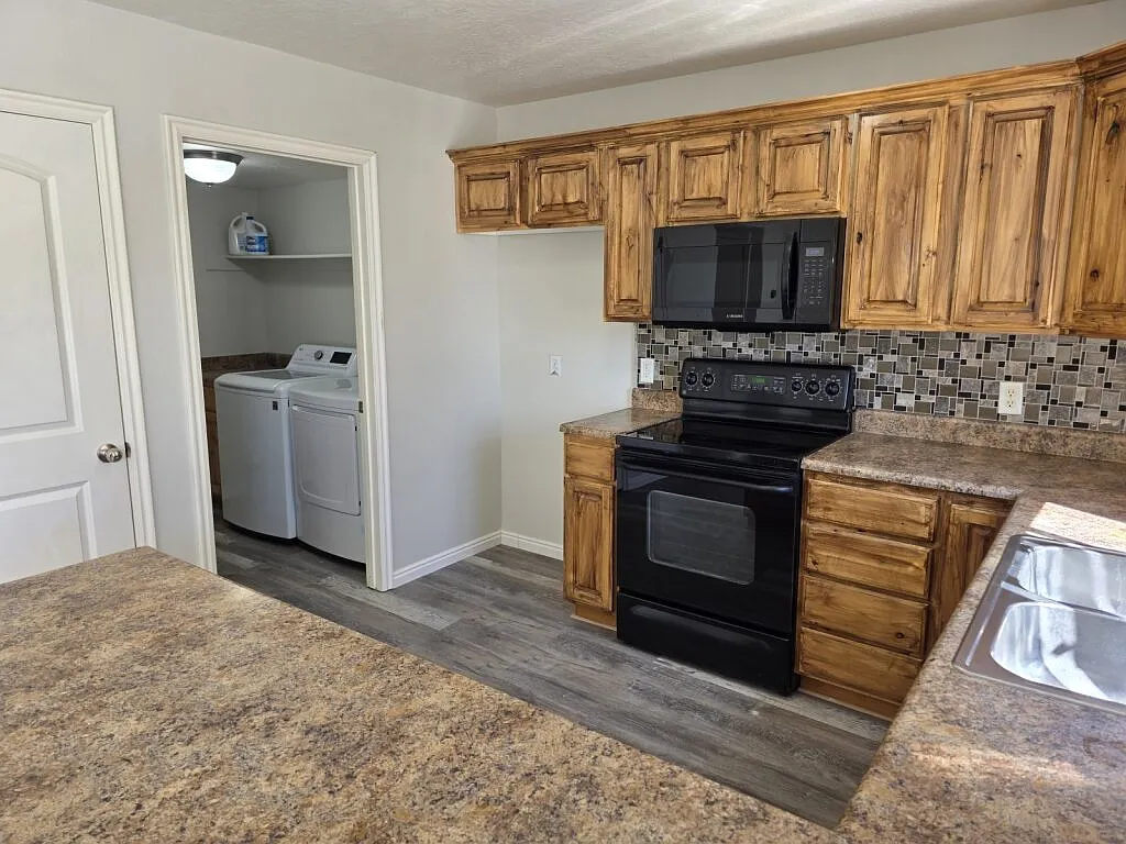 Stainless steel refrigerator coming soon. Electric Stove and pantry lots of cabinet space and laundry room with shelves - 1218 E Black Horse Dr