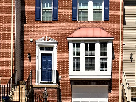 Brick front, one car garage with built-in storage, all new double-hung windows with child safety locks, and new roof