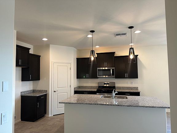 Spacious island with granite countertops