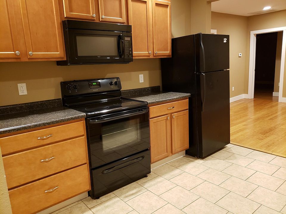 Large kitchen with newer counters, cabinets and appliances.