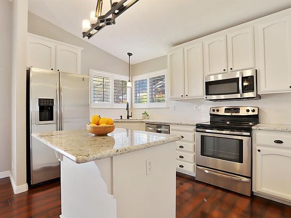 Updated kitchen with stainless steel appliances and granite counters. The refrigerator is also included!