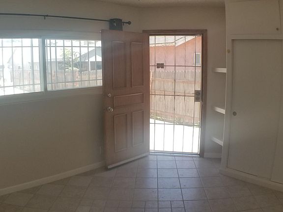 Gated front door and large window. Room darkening window coverings are included