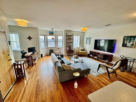 Main room looking south east, with entry door on the left. This top-floor unit gets amazing light all morning and afternoon.