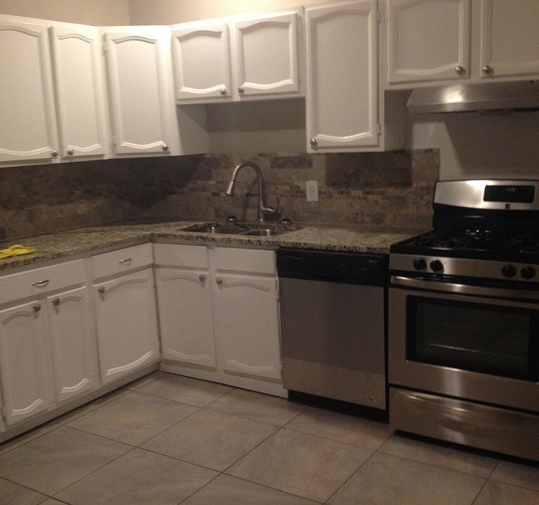 A gorgeous backsplash sets the tone for the granite countert