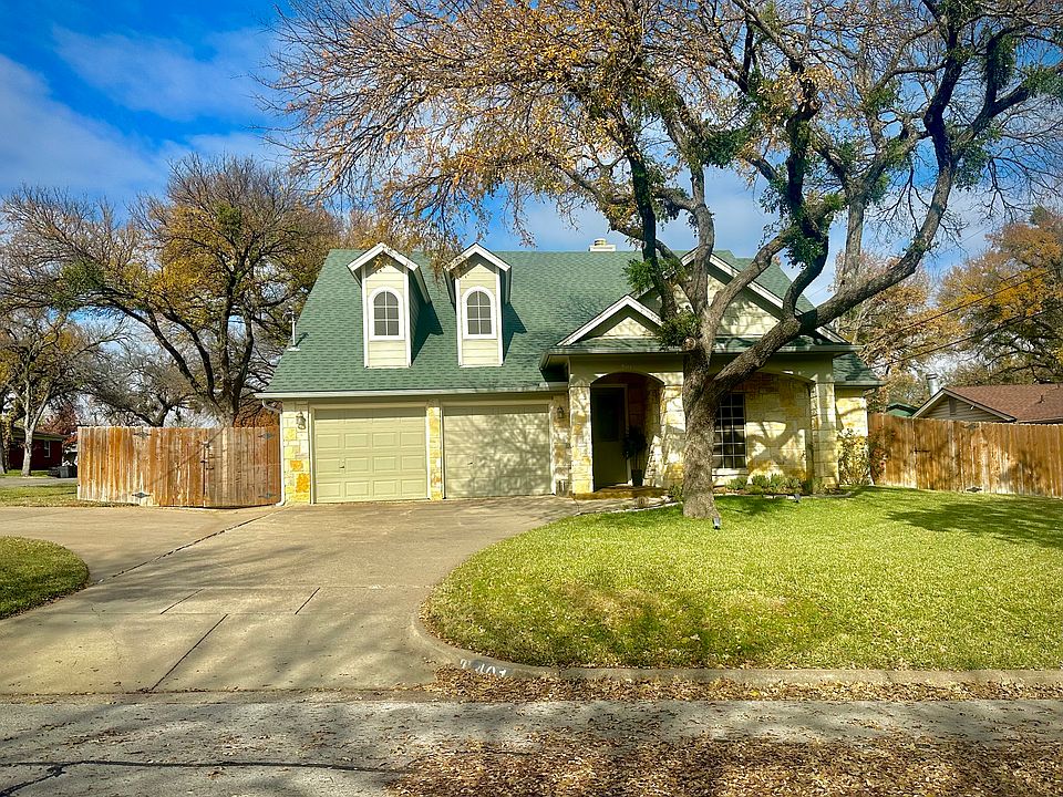 Front yard view located on a corner lot.