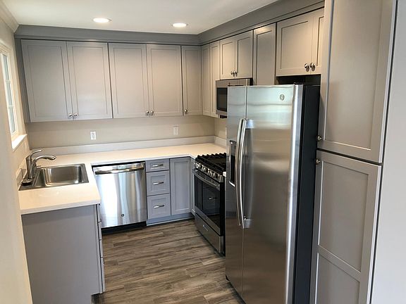 Brand New Kitchen. Tile floors, Stainless steal appliances, New kitchen cabinets, and quartz counters.
