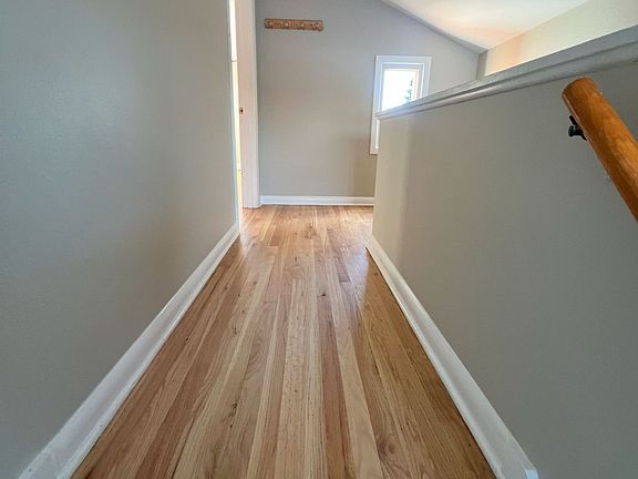 A beautiful stair lending leading to the Living room with great landing nook perfect for a samll relaxing recliner for reading or setup a office on