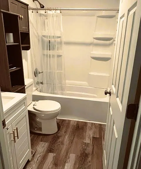 bathroom with over-the-toilet storage