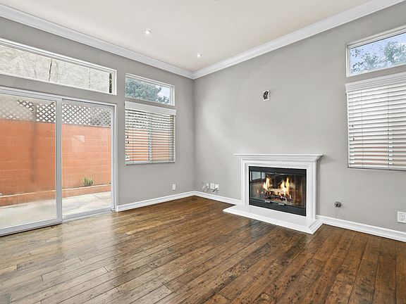 open concept living room with slider to back yard