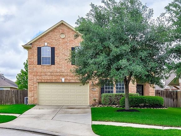 Mature trees make the home feel warm and inviting.
