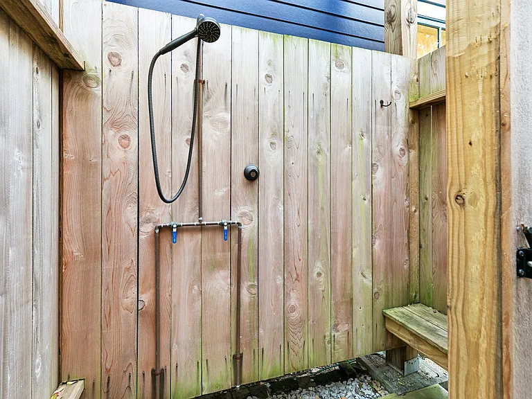 Outdoor shower in backyard