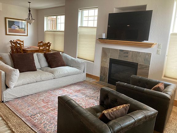 Spacious living area, cozy gas fire, TV.