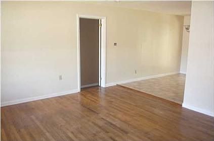 Living room looking into dining area off kitchen