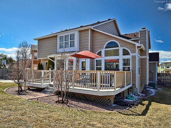Fenced back yard with composite deck