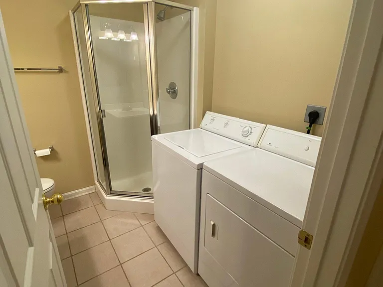 Washer and Dryer stay in unit. Large linen closet behind the door.
