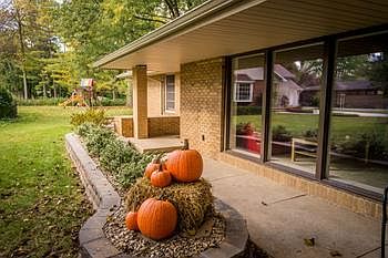 Front entry with additional patio and seating area with new landscaping in 2012/2013.