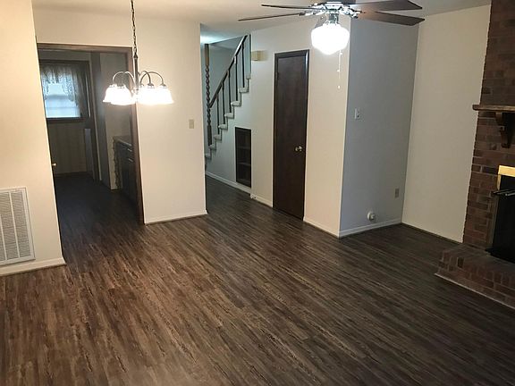 LR view into foyer with half bath (door closed)