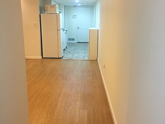 View from hallway into living room & kitchen