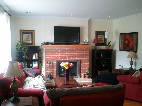 Living room with wood burning fireplace