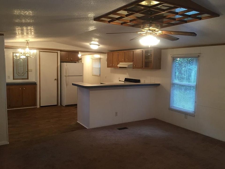 Spacious open concept living area/kitchen with convenient breakfast bar