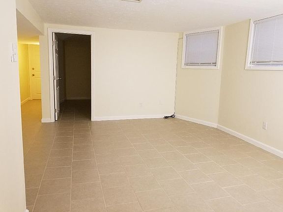 Liv Area showing doorway to Bedroom, hallway to front Apt door,taken from the short hallway into bath and kitchen.