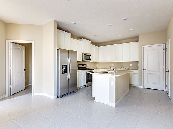 The chef-ready kitchen features gorgeous stainless-steel appliances
