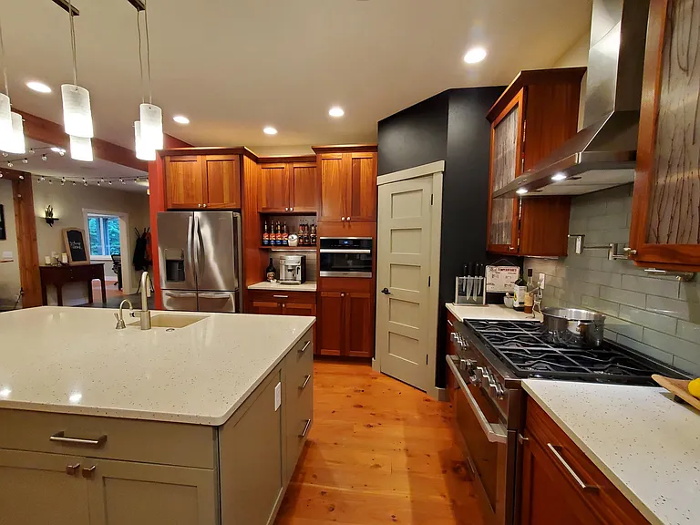 Gourmet kitchen with 36" propane Miele range, Miele combi-steam oven (ask me how I never use a microwave), Sapele cabinets and a walk-in pantry.