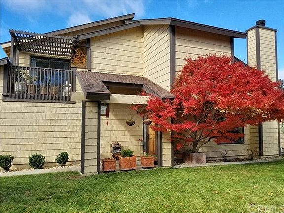Beautiful trees and upstairs balcony overlooking this side yard