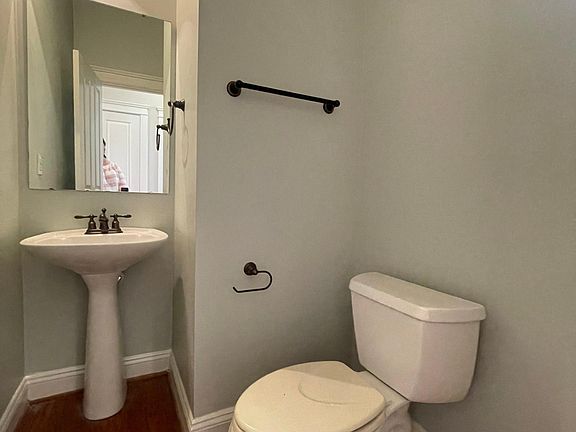 Powder room in breezeway between kitchen and dining.