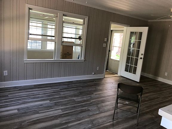 Den looking toward enclosed front porch