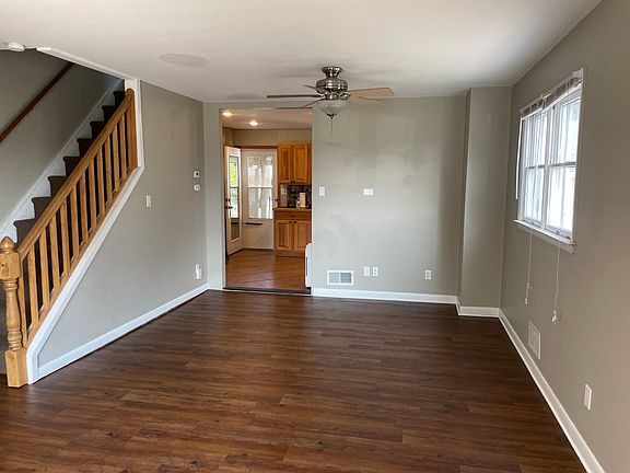 View from front of house into kitchen area showing back door