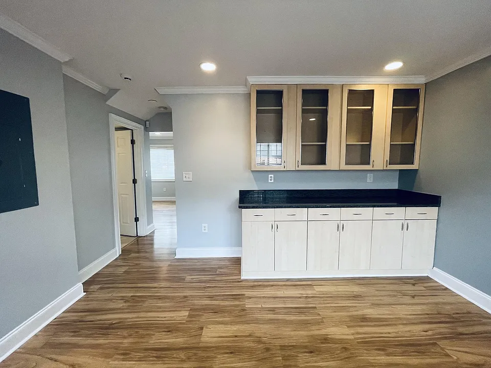 Enjoy the serene ambiance of our versatile dining room, offering views of the private backyard. This inviting space features ample natural light, and modern furnishings, perfect for hosting intimate gatherings or enjoying peaceful meals with loved ones.