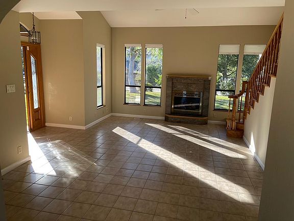 Entry Sunroom with access to Kitchen/Family Room, upstairs Loft, bed rooms and Living Room.