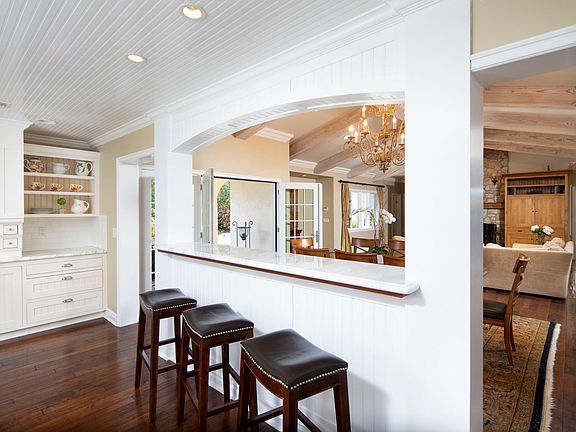 Kitchen and dining area area central gathering space that combines timeless rustic charm with modern day amenities.